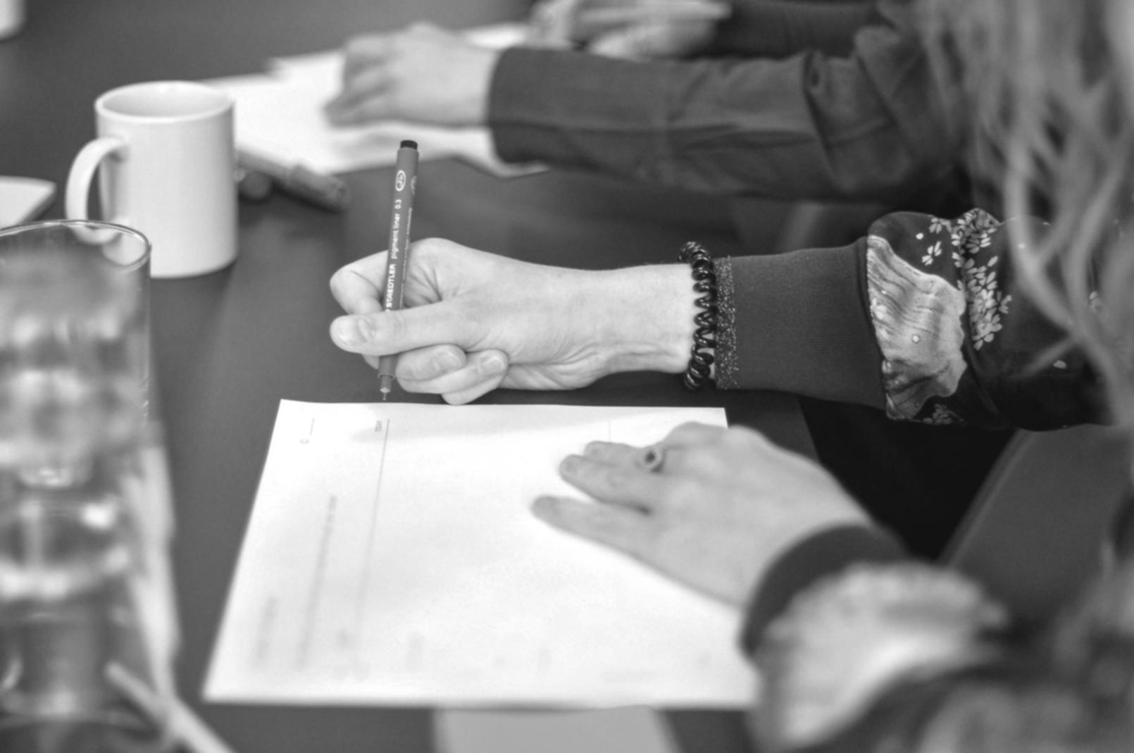 Professional testing environment with multiple monitors showing code analysis and testing frameworks